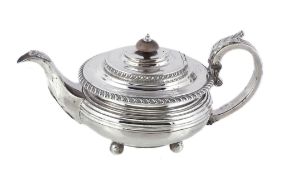 A George IV silver compressed spherical tea pot by William Bennett, London 1824, with a composition