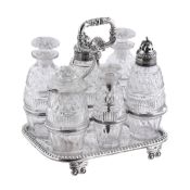 A late George III silver and cut glass six bottle cruet set by Robert Gainsford, Sheffield 1813,