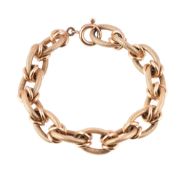A 1970s gold coloured bracelet, composed of interlinking textured and polished links, to a ring