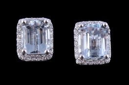 A pair of aquamarine and diamond earrings, the rectangular cut aquamarines claw set within a