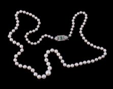 A single strand cultured pearl necklace, the graduating cultured pearls to an emerald and eight cut