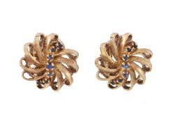 A pair of sapphire earrings, the looping swirled gold coloured earrings, set with circular cut