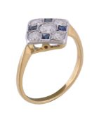 A diamond and sapphire panel ring, the central brilliant cut diamond, estimated to weigh 0.40