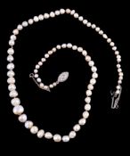 A graduated natural and cultured pearl necklace, the eighty three slightly baroque shaped pearls to