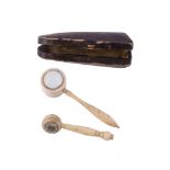 Ω Two unusual early/mid 19th century miniature magnifying glasses, in ivory and in bone, with