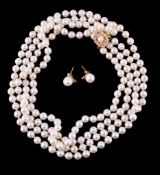 A two row cultured pearl necklace, the two rows composed of uniform cultured pearls, to a basket