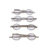Four spectacles, comprising: one George III silver by James Davenport, London 1803 (maker' mark and