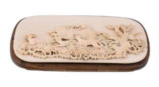 Ω An ivory and gilt metal rounded rectangular spectacles case, circa 1880, the upper cover carved