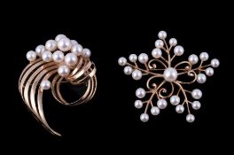 A cultured pearl brooch by Mikimoto, the snowflake design set with cultured pearls, signed