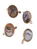 Four late Victorian reverse painted intaglio buttons, circa 1900, the oval panels each painted with