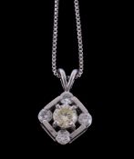 A diamond pendant, the squared pendant with brilliant cut diamonds at the cardinal points and a