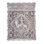An Indian silver shaped rectangular card case, Madras, late 19th century, chased in Swami style,