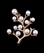 An 18 carat gold brooch by Mikimoto, the branch like brooch with cultured pearl accents , with