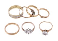 A small collection of rings , to include a two colour band ring, stamped 585; two gold coloured