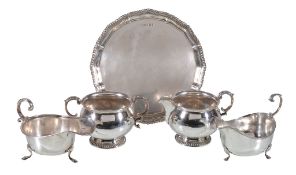 Five items of silver, comprising: a shaped circular small salver by H. L. Brown & Son, Sheffield