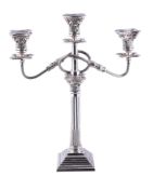 A silver three light candelabrum by Alexander Smith, Birmingham 1959, with beaded sconces, the