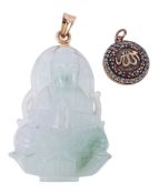 A bowenite Buddha pendant , the panel carved with a seated Buddha, to a gold coloured suspensory