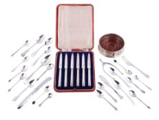 A collection of silver small flatware, mainly tea spoons, mainly 20th century, one knife loaded and