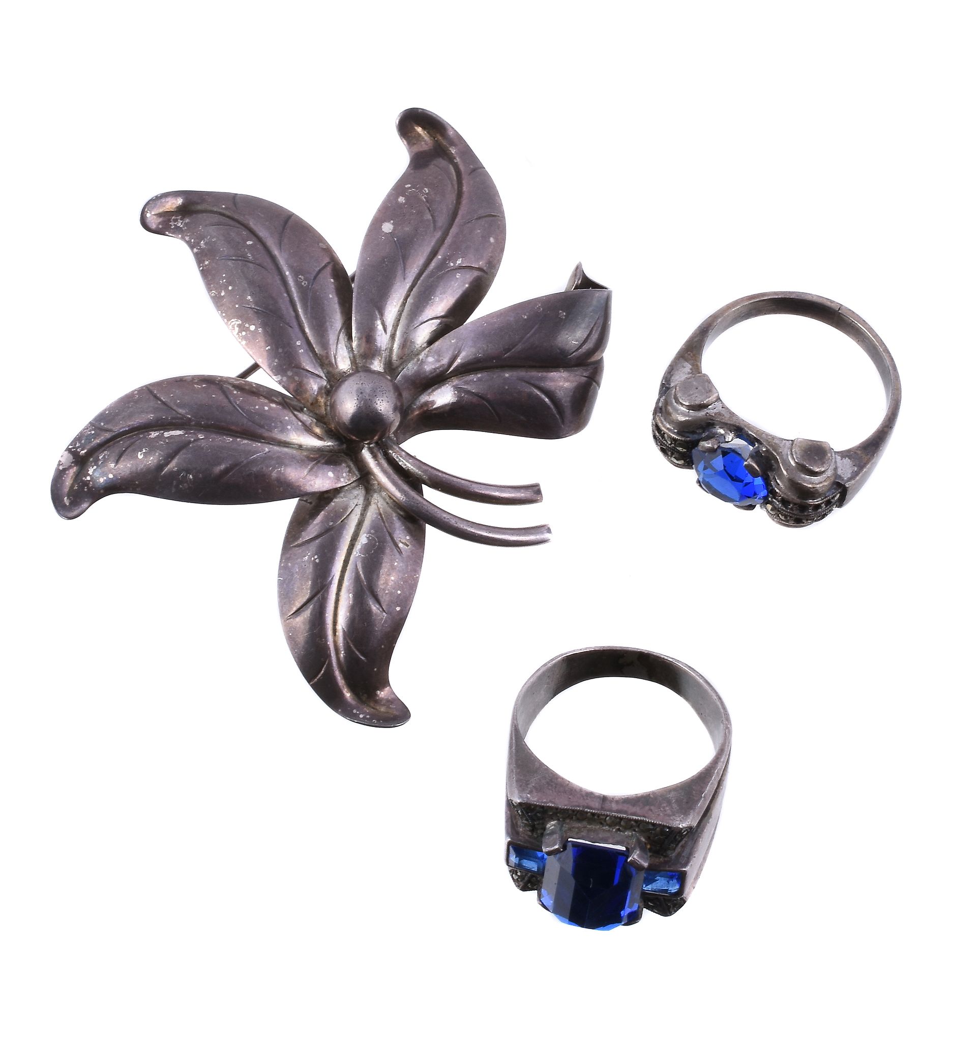 A 1940s French silver, paste and marcasite ring, of tank style, set with a circular cut blue paste