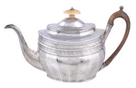 Ω A George III silver oval tea pot by Alice & George Burrows II, London 1803, with an oval ivory