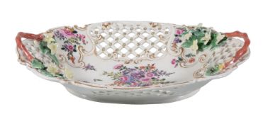 A Worcester pierced oval two-handled basket, circa 1770, painted with flowers, applied with twig