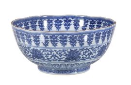 An Arita blue and white bowl , decorated with bands of stylised lotus, lappets and pendant flowers,