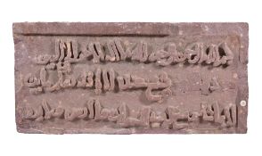 An Indian mottled pink sandstone relief, 19th century, with Islamic script, possibly Persian, 51.
