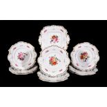 An English porcelain part dessert service, circa 1830, painted with flowers, comprising a serving