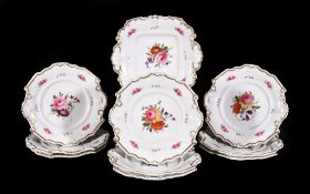 An English porcelain part dessert service, circa 1830, painted with flowers, comprising a serving