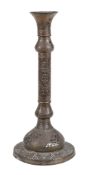 A large copper candlestick, Egypt, circa 1900, with alternating reticulated foliage and script, 56.