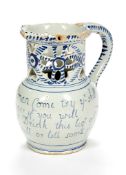 An English delft blue and white puzzle jug, probably Liverpool, mid 18th century, the cylindrical