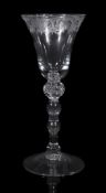 An engraved light baluster goblet of 'Newcastle' type, mid 18th century, the bell bowl engraved