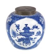 A Chinese blue and white ginger jar, Kangxi, painted with panels of precious objects on a 'cracked-