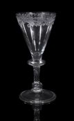 An engraved balustroid wine glass , mid 18th century, English or Low Countries, the funnel bowl