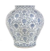 A large Chinese blue and white vase , painted with circular characters within scrolling foliage,