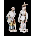 A pair Meissen figures of an Oriental man and woman, first half 20th century, blue crossed swords