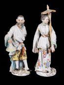 A pair Meissen figures of an Oriental man and woman, first half 20th century, blue crossed swords