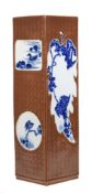 A large Chinese cafe-au-lait ground blue and white vase, two sides with moulded leaf panels and two