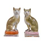 Two similar Staffordshire models of cats, third quarter 19th century, modelled facing left and