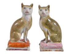 Two similar Staffordshire models of cats, third quarter 19th century, modelled facing left and