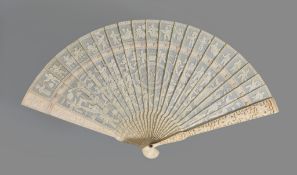 Ω A Chinese ivory monogrammed brise fan, Canton, circa 1820, carved on one side with interlaced