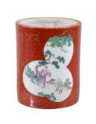 A Chinese 'coral ground' brush pot, bitong, painted in green and famille rose enamels with two