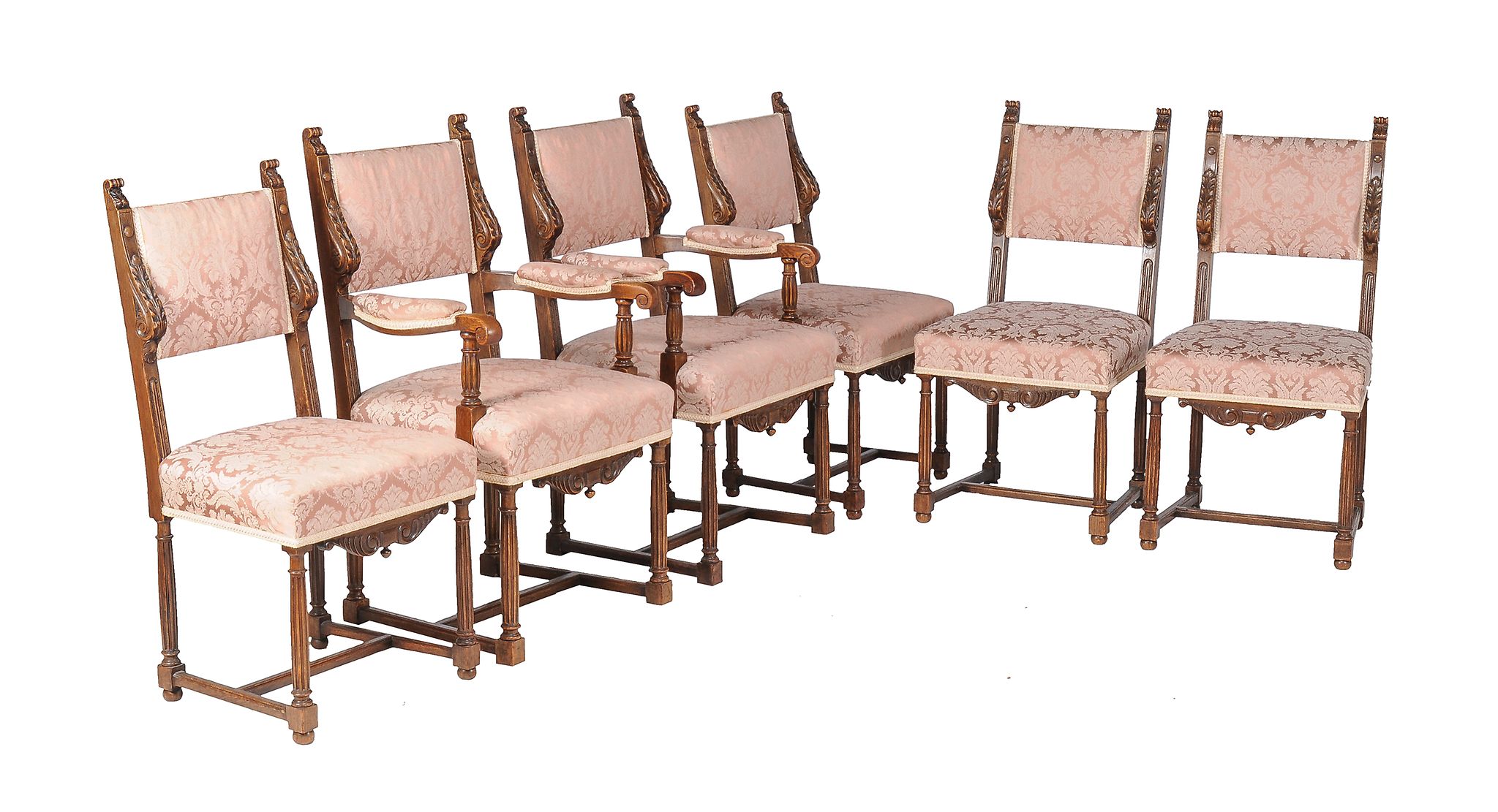 A set of six oak and upholstered dining chairs , to include a pair of armchairs, each with label