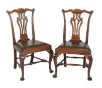 A pair of George II walnut side chairs , circa 1750, in the manner of Thomas Chippendale, each with