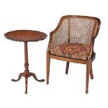 A mahogany bergere armchair , 19th century, with caned back and seat, together with a mahogany