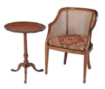 A mahogany bergere armchair , 19th century, with caned back and seat, together with a mahogany