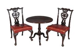 A pair of George III mahogany dining chairs, circa 1760, each with red leather seats, together with