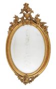 A Victorian giltwood and composition oval wall mirror, second half 19th century, with later