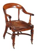 A William IV mahogany library armchair , circa 1835, with solid seat and turned supports