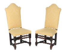 A pair of ebonised walnut highback side chairs , circa 1700, each with yellow upholstery